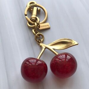 COACH Gold Cherry Keychain with Red Glitter Cherries